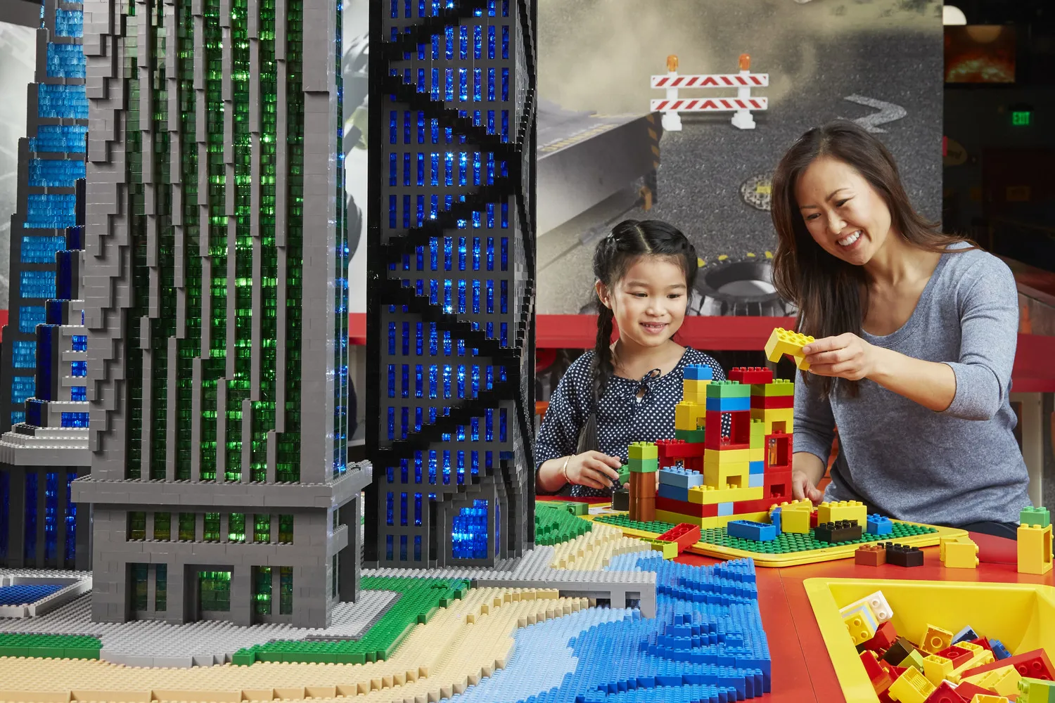 Mother and Daughter building using LEGO DUPLO Bricks at LEGOLAND Discovery Center.
